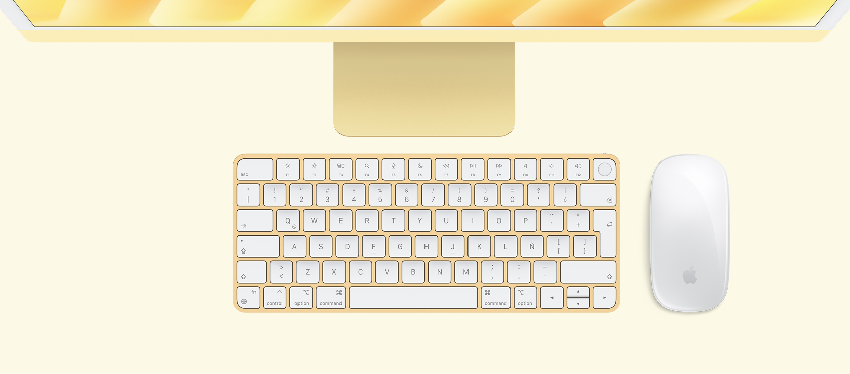 Vista panorámica de un iMac amarillo con mouse y teclado a juego