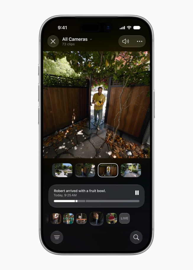 Tela de um iPhone 17 Pro no app Casa mostra a visualização de uma câmera de segurança com a descrição gerada “Robert chegou com uma cesta de frutas”.