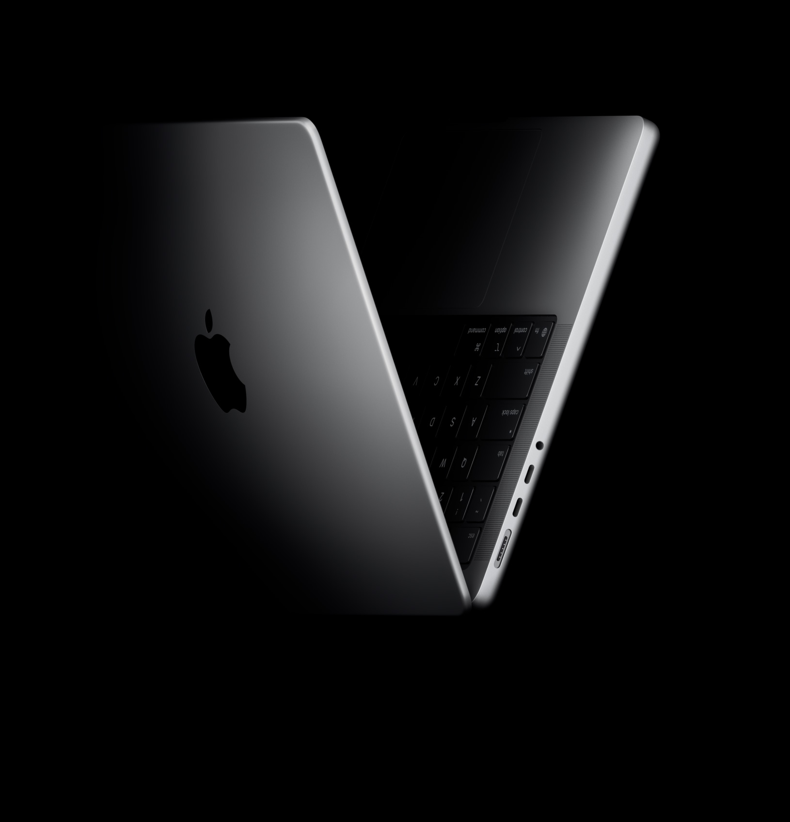 Un MacBook Pro abierto en forma de V, en referencia a los chips de la familia M5